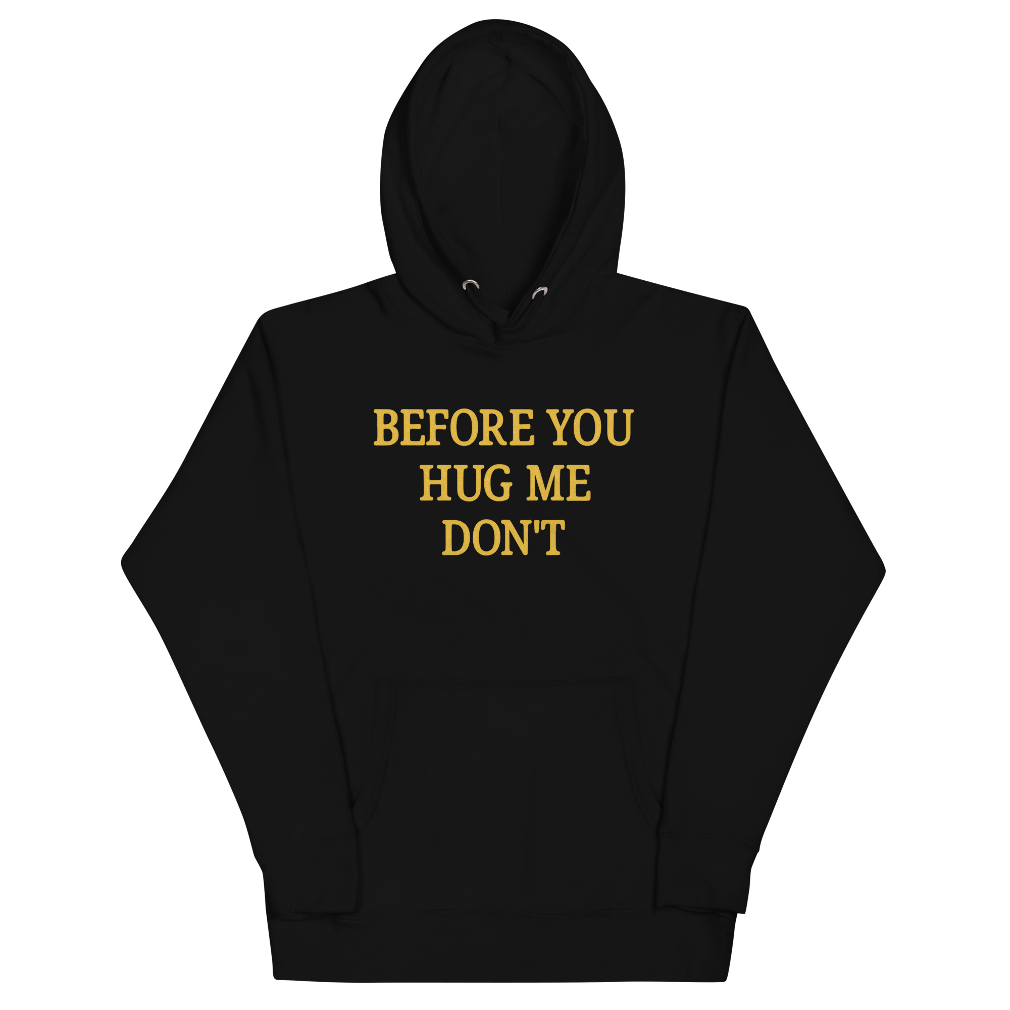 Black hoodie with bold yellow serif text “Before You Hug Me Don’t” – sarcastic fashion for introverts and anti-hug personalities
