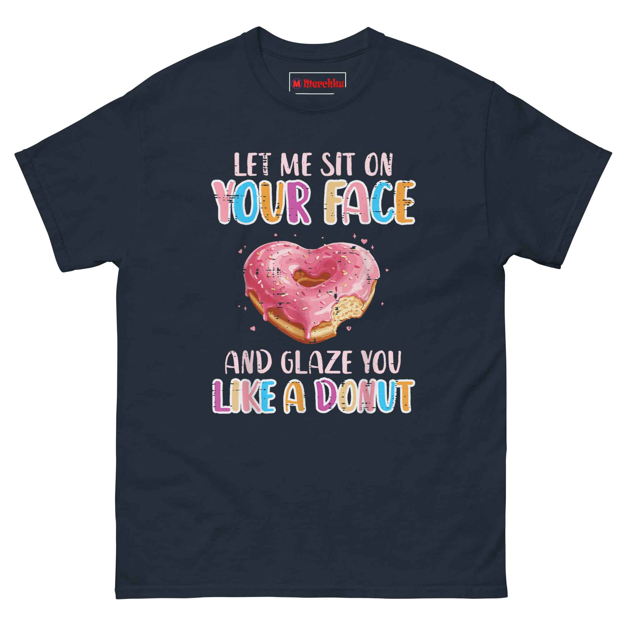 Front view of a navy blue t-shirt for adults featuring a pink heart-shaped glazed donut and the sarcastic quote "Let Me Sit On Your Face and Glaze You Like a Donut" in colorful letters.